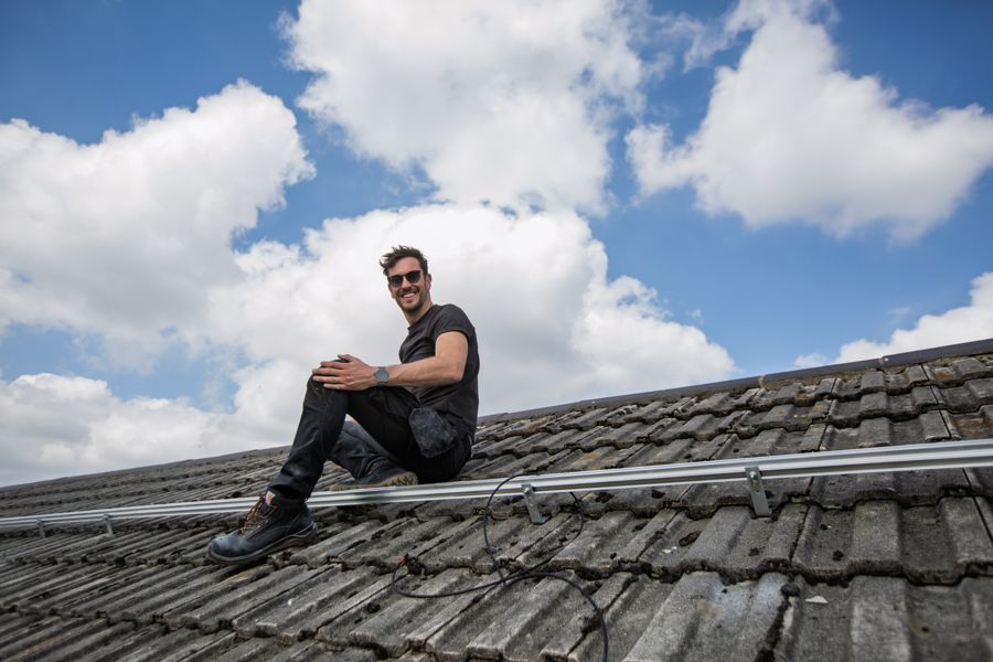 Sitting on the roof between rails on a sunny day